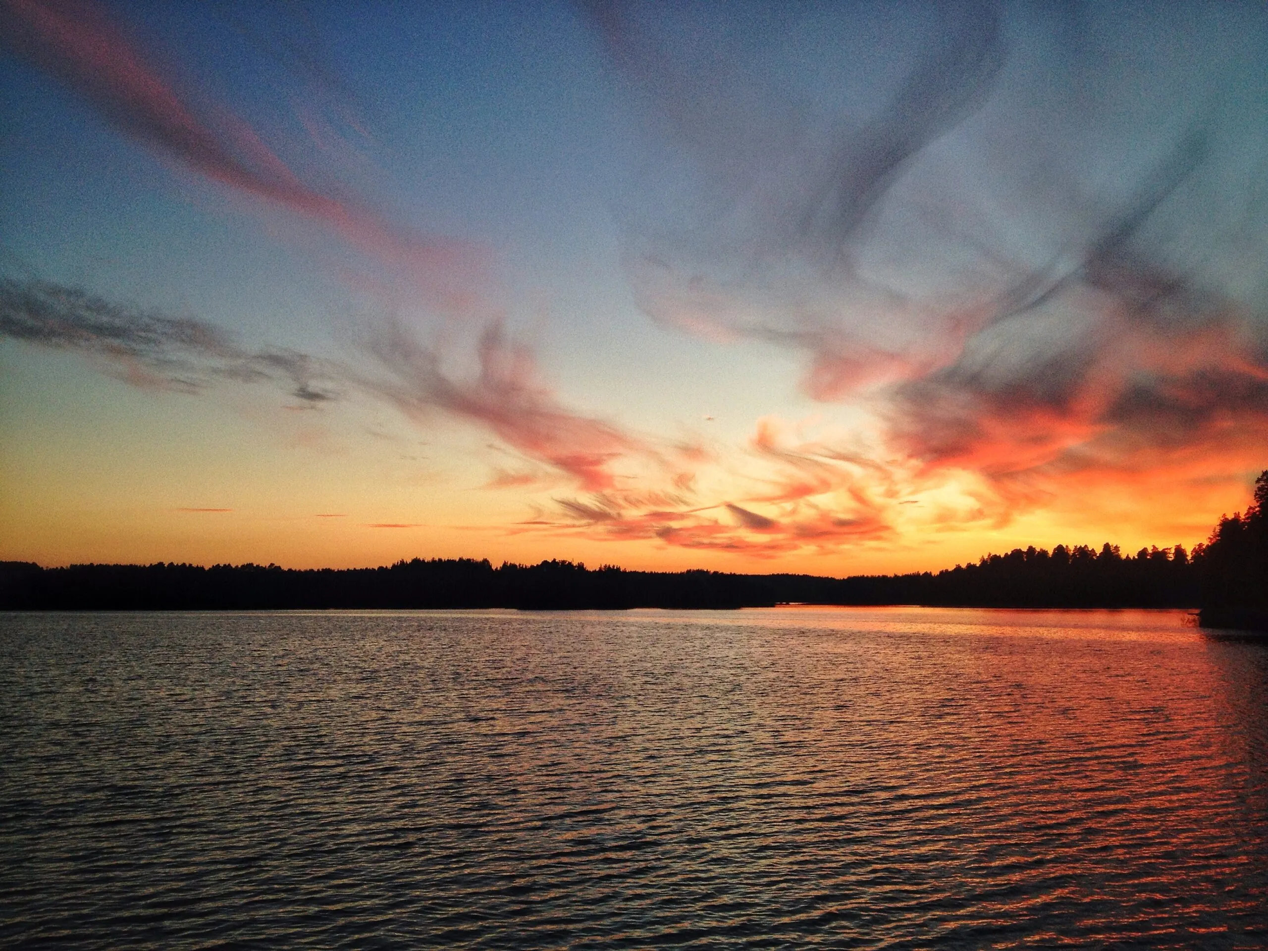 a sunset over a lake